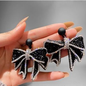 Fun Fancy Glitzy Black & Silver Lg Bow Fashion Earrings with Rhinestone Crystals